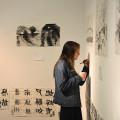 Jessica Vogel'15 identifies a painting she created in a workshop with Chinese landscape painter Master Zhang Jin.