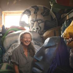 Sandy Spieler'75 in the attic where In the Heart of the Beast stores their archive of puppets.