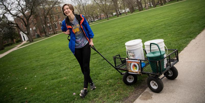 Jennifer Pantelios'19 collects food scraps across campus with a compost wagon. She establishe...